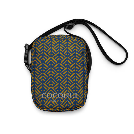 a crossbody bag with shark teeth pattern lay on a white background 